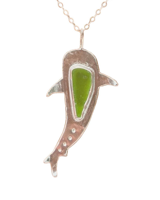 Shark-shaped sterling silver pendant featuring a piece of sea glass.